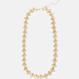 Elk Hvass gold necklace featuring a delicate chain and minimalist pendant, stylish jewelry for everyday wear.