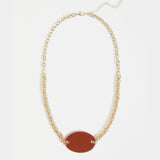 Elk Innfellt necklace with spice-themed pendant, featuring intricate design and vibrant colors, stylish jewelry accessory.