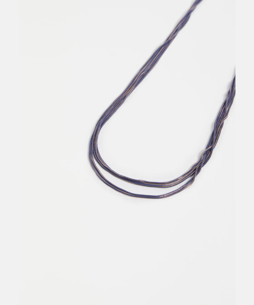 Elk Lina Necklace in cobalt blue featuring a sleek, modern design with a silver chain and minimalist pendant.