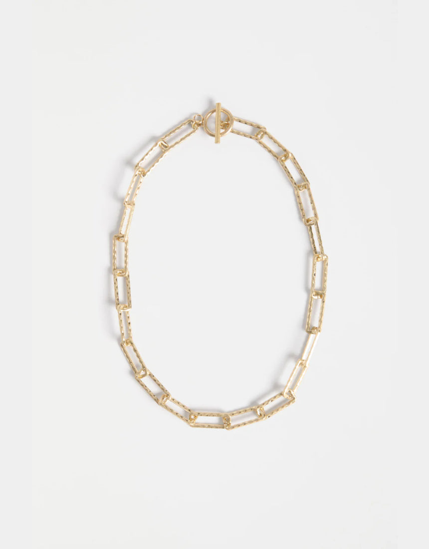 Gold Elk Ringva necklace showcasing a delicate chain with a sleek, modern pendant design.