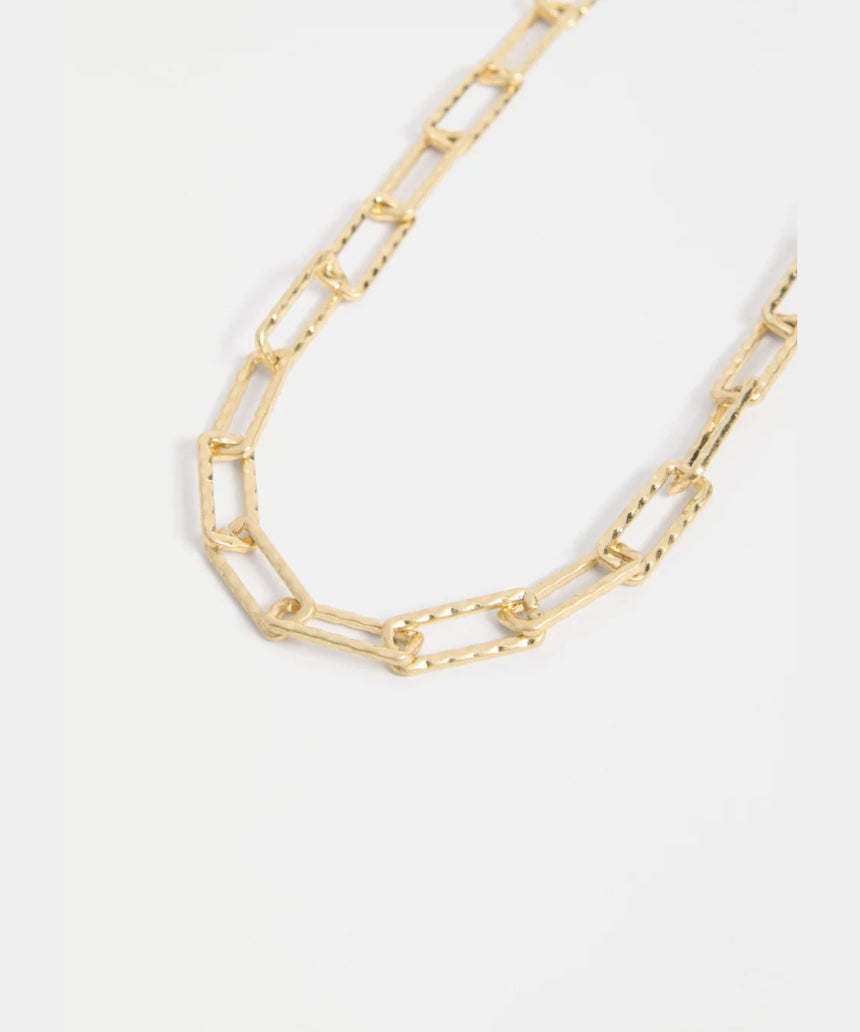 Gold Elk Ringva Necklace featuring a sleek, minimalist design with a smooth, polished finish.