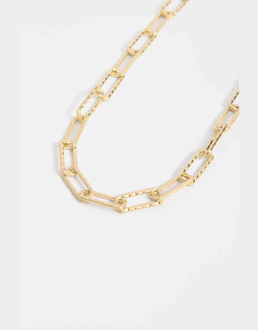 Gold Elk Ringva Necklace featuring a sleek, minimalist design with a smooth, polished finish.