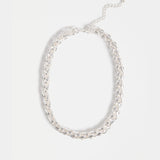 Silver Elk Samman Necklace with intricate pendant design, showcasing craftsmanship and elegant jewelry style.
