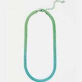 Elk Vera short necklace with green and blue ombre beads, showcasing a vibrant, layered jewelry piece on a neutral background.