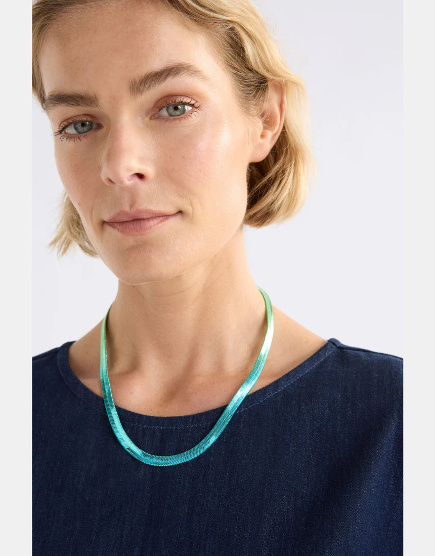 Elk Vera short necklace with green and blue ombre beads, showcasing a stylish and colorful jewelry piece on a neutral background.