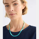 Elk Vera short necklace with green and blue ombre beads, showcasing a stylish and colorful jewelry piece on a neutral background.