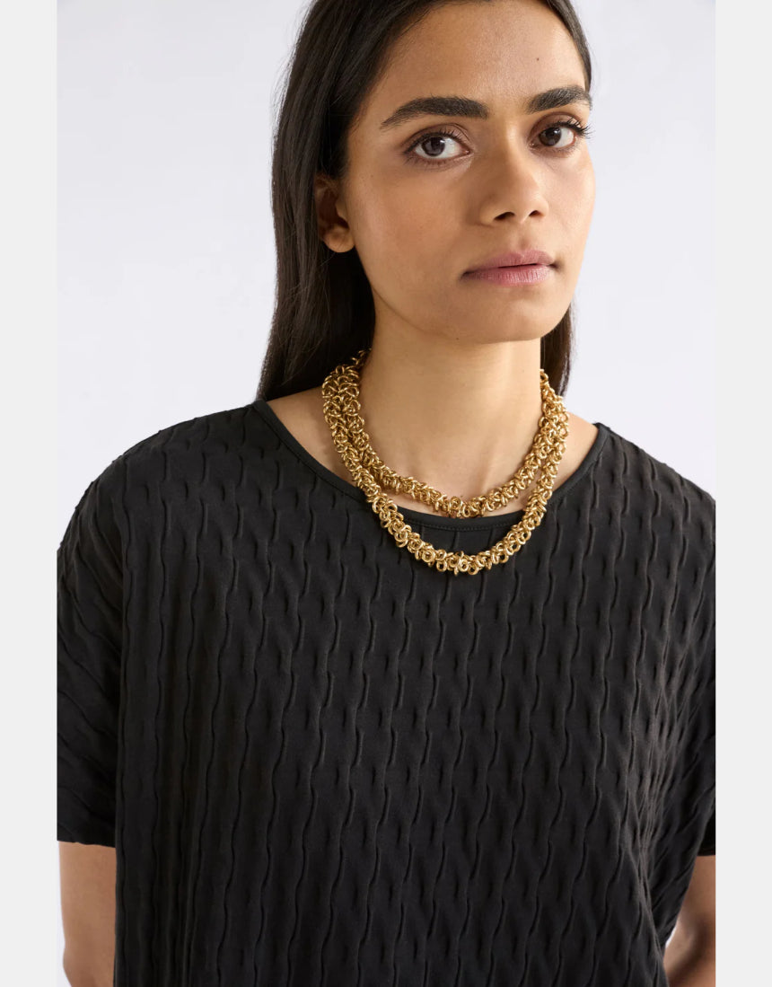 Gold Elk Hava necklace with intricate chain and pendant design, showcasing elegant jewelry craftsmanship.