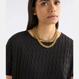 Gold Elk Hava necklace with intricate chain and pendant design, showcasing elegant jewelry craftsmanship.