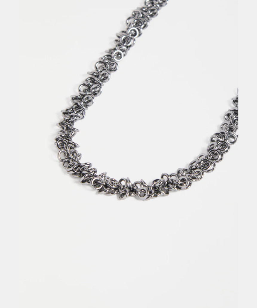 Elk Hava necklace in gunmetal with a sleek, modern design featuring layered chain details.