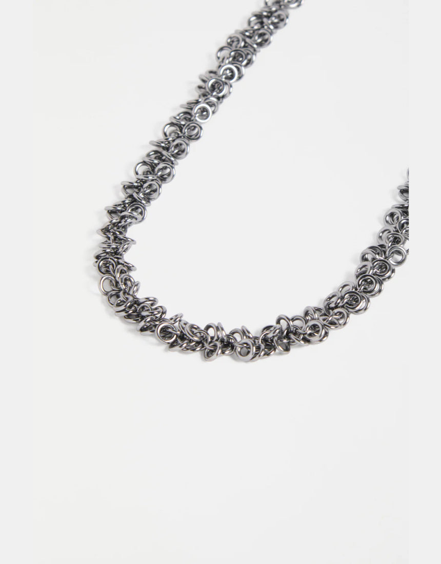 Elk Hava necklace in gunmetal with a sleek, modern design featuring layered chain details.