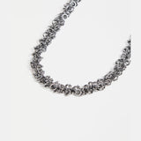 Elk Hava necklace in gunmetal with a sleek, modern design featuring layered chain details.