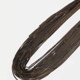 Elk Kade black necklace featuring sleek, minimalist design with a smooth pendant on a black cord.