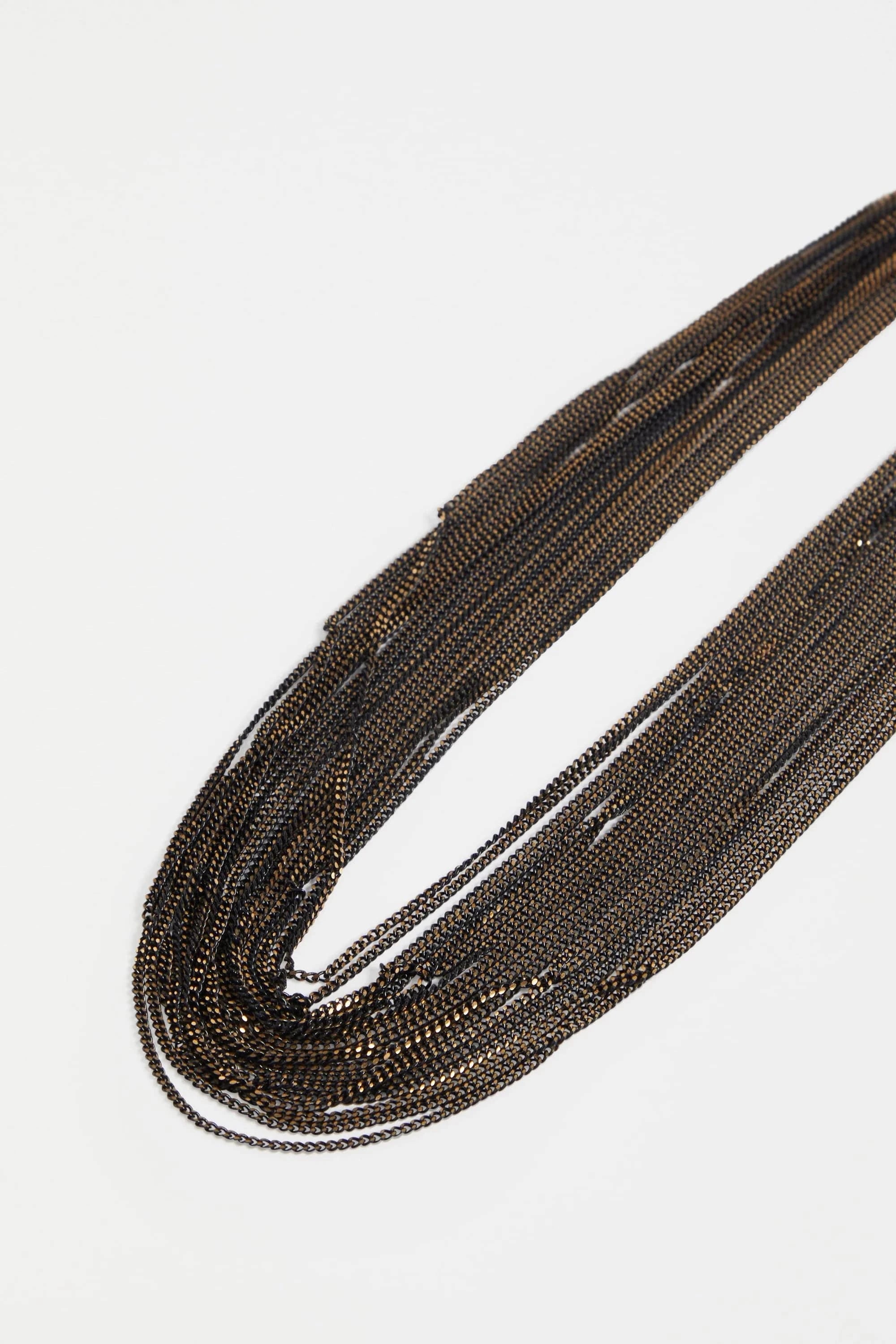 Elk Kade black necklace featuring sleek, minimalist design with a smooth pendant on a black cord.