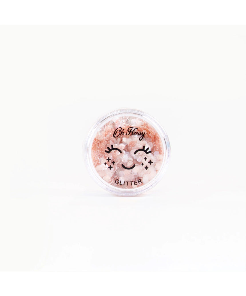 Pink biodegradable glitter by Oh Flossy, shaped like fairy dust, perfect for kids' natural makeup and craft projects.