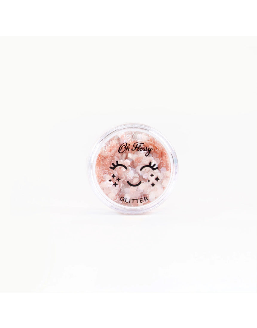 Pink biodegradable glitter by Oh Flossy, shaped like fairy dust, perfect for kids' natural makeup and craft projects.