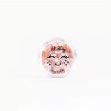 Pink biodegradable glitter by Oh Flossy, shaped like fairy dust, perfect for kids' natural makeup and craft projects.