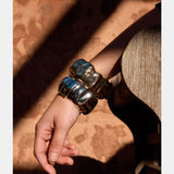Elk Dalen Bangle Gold bracelet featuring a sleek, minimalist gold design with smooth finish and subtle branding.