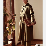 Olive green Elk Stuud long shirt dress displayed on a hanger, showcasing its relaxed fit and casual style.