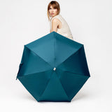 Anatole Octave Micro-Umbrella in mineral blue, open, showing its compact design and vibrant color against a white background.