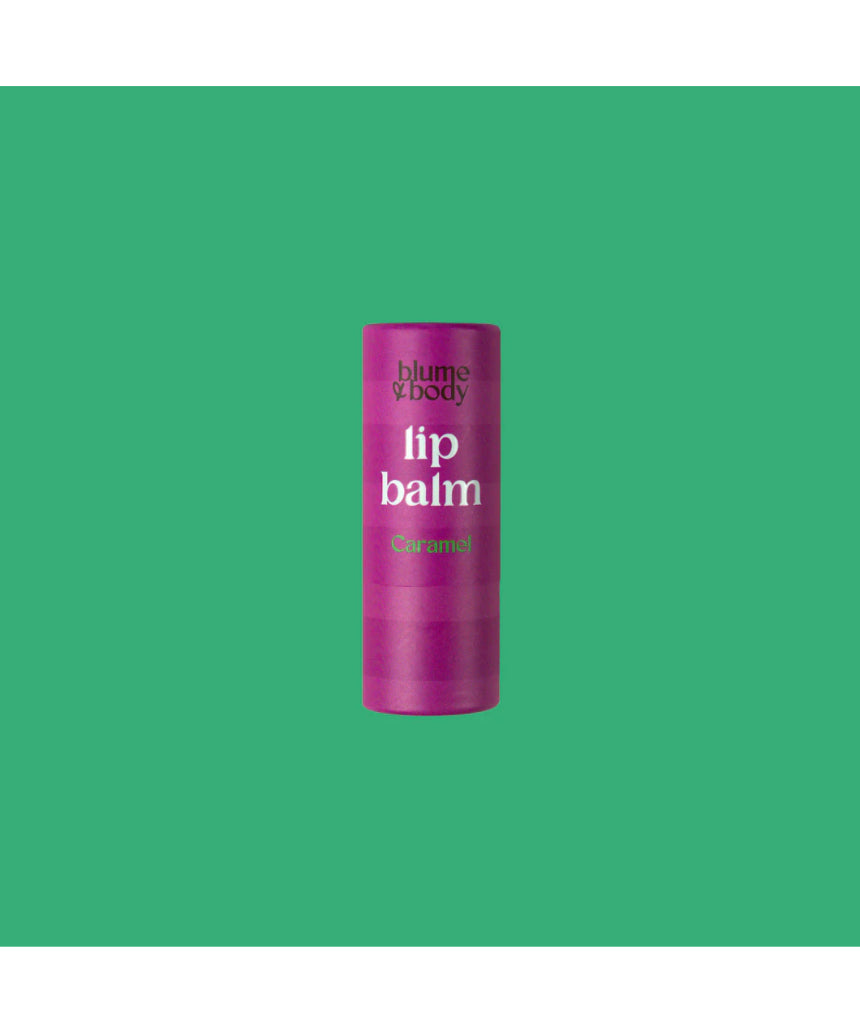 Pink Bloom & Body caramel lip balm tube with a smooth, rounded shape and soft pink packaging, ideal for moisturizing lips.