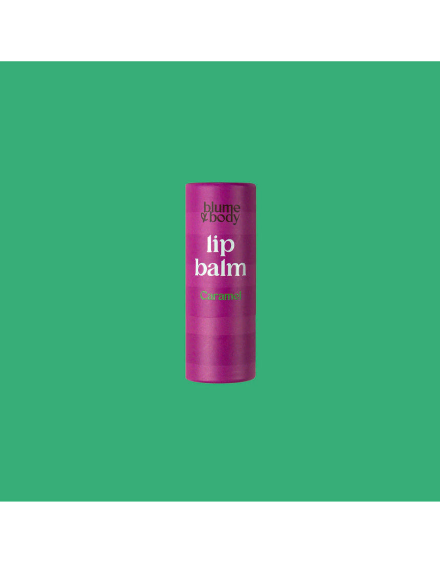 Pink Bloom & Body caramel lip balm tube with a smooth, rounded shape and soft pink packaging, ideal for moisturizing lips.