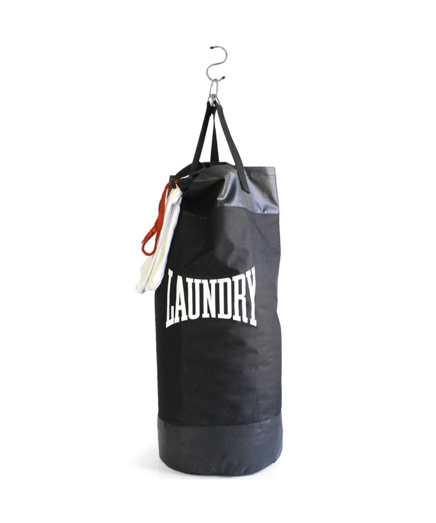 Suck UK Punch laundry bag with bold punch design, made of durable fabric and featuring a sturdy handle for easy carrying.