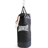 Suck UK Punch laundry bag with bold punch design, made of durable fabric and featuring a sturdy handle for easy carrying.