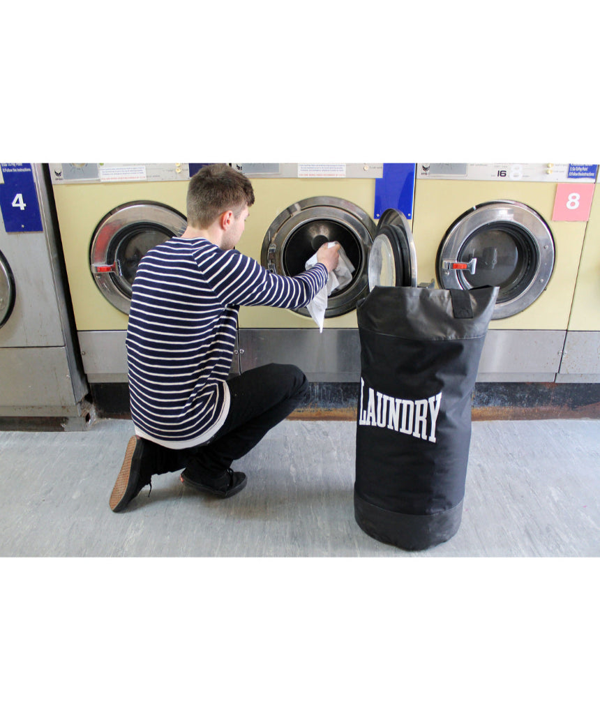 Suck UK Punch laundry bag with bold punch design, made of durable fabric for easy laundry storage and transport.