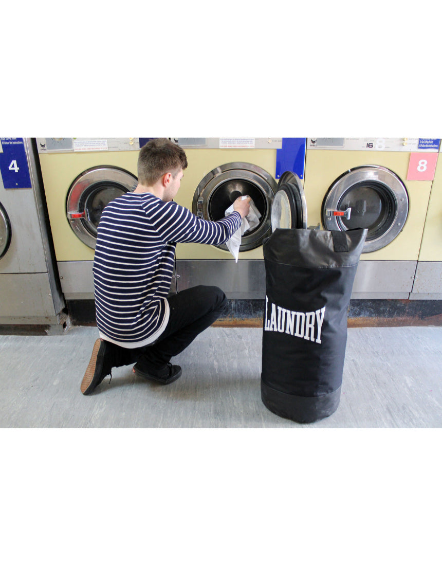 Suck UK punch laundry bag with bold graphic design, made of durable fabric for storing laundry in a stylish way.