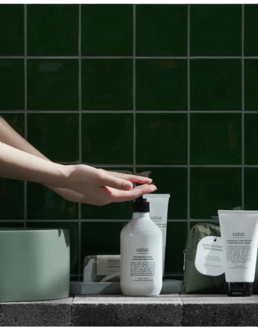 Salus Quintessential Skin Quartet hand wash set with four bottles featuring natural ingredients and elegant packaging.