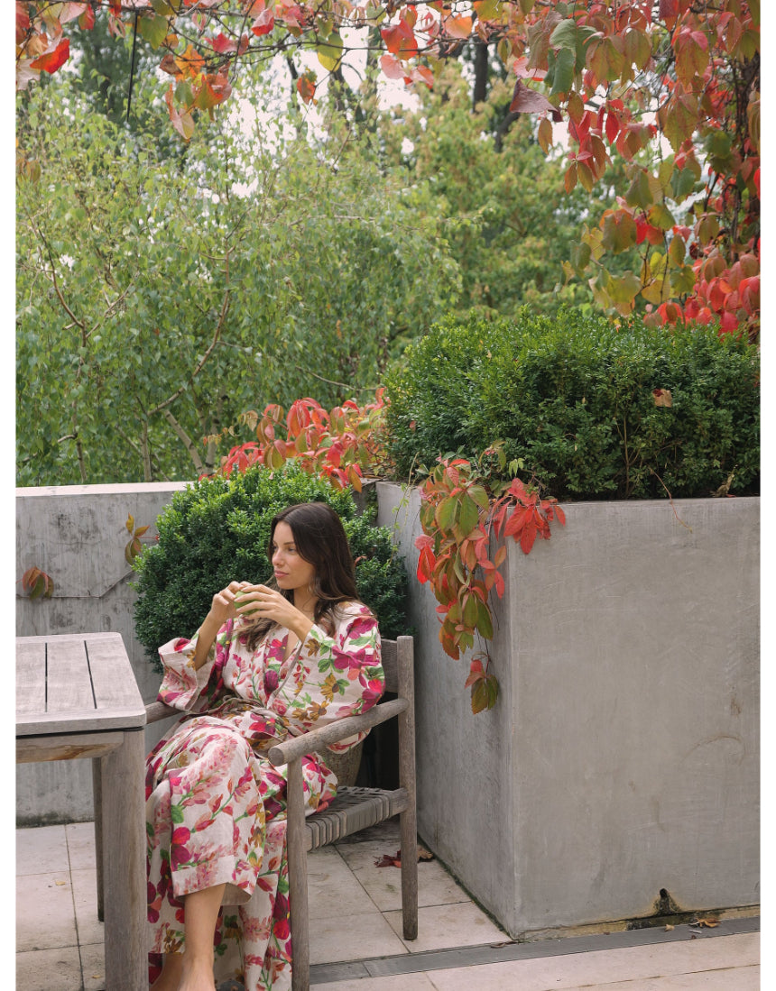 Bonnie and Neil Lupin Multi Linen Robe set styled in a bedroom with the robe draped over a bed, showcasing soft fabric and colorful pattern.