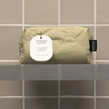Salus Replenish Skin Set in a sleek bag, featuring skincare products designed to hydrate and rejuvenate the skin.