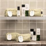 Salus Replenish Skin Set with skincare products, featuring bottles and jars in a natural setting for healthy, hydrated skin.