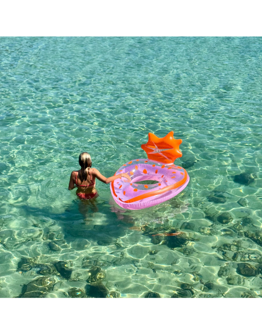 Sunnylife Luxe Pool Ring in strawberry pink, a fun inflatable pool float with a stylish design for summer swimming.