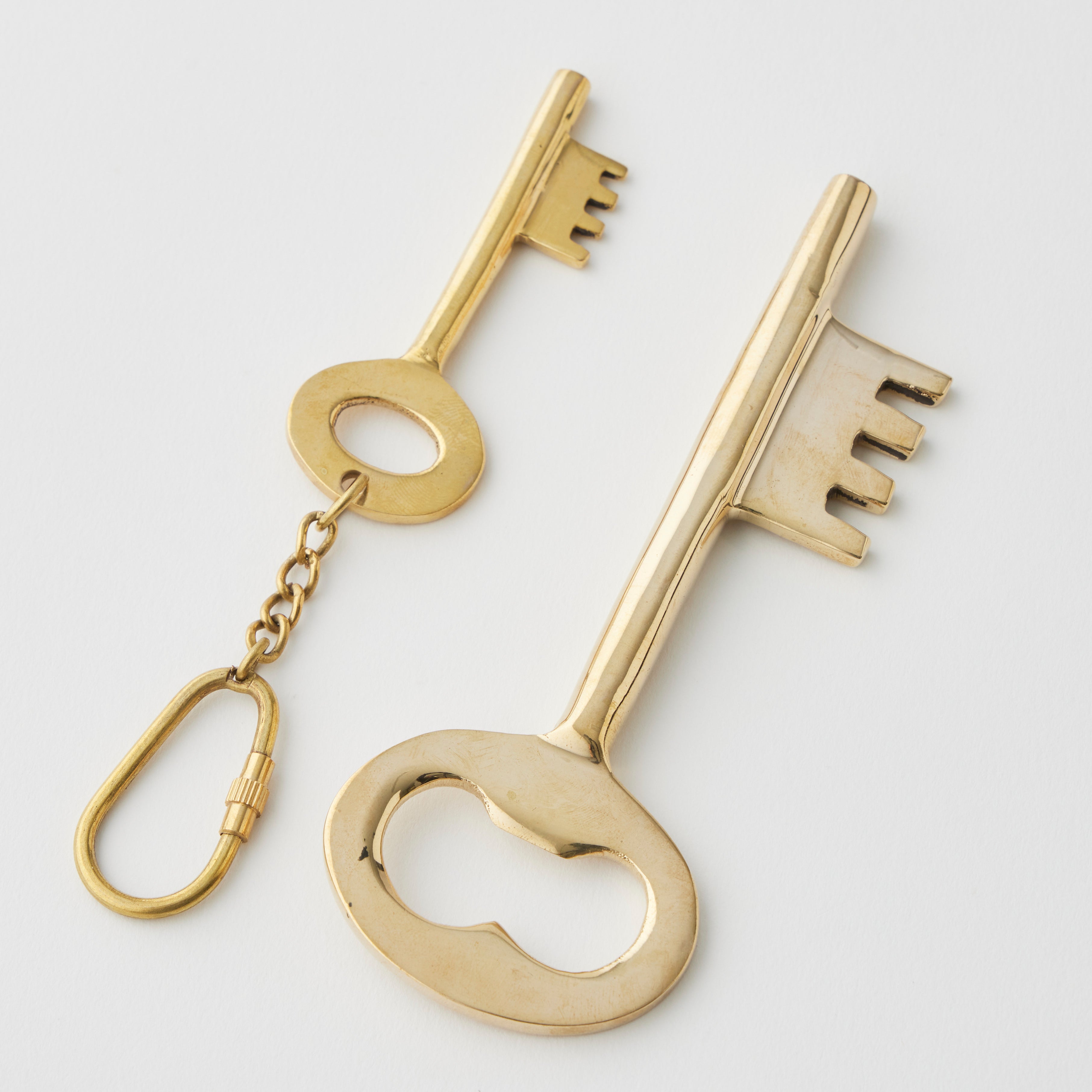 Pilbeam Living gold key bottle opener and keyring set, stylish and functional bar tool and key accessory in a compact design.