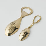 Gold Pilbeam Living football-themed bottle opener and keyring set, featuring a stylish design and practical keyring attachment.