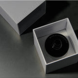 Solid State Hash Extrait de Parfum cologne bottle with sleek design and clear glass showcasing the fragrance inside.