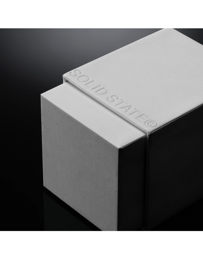 Solid State Wayfarer Extrait de Parfum cologne bottle with sleek design and minimalist label, displayed against a neutral background.