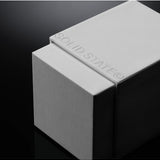 Solid State Wayfarer Extrait de Parfum cologne bottle with sleek design and minimalist label, displayed against a neutral background.