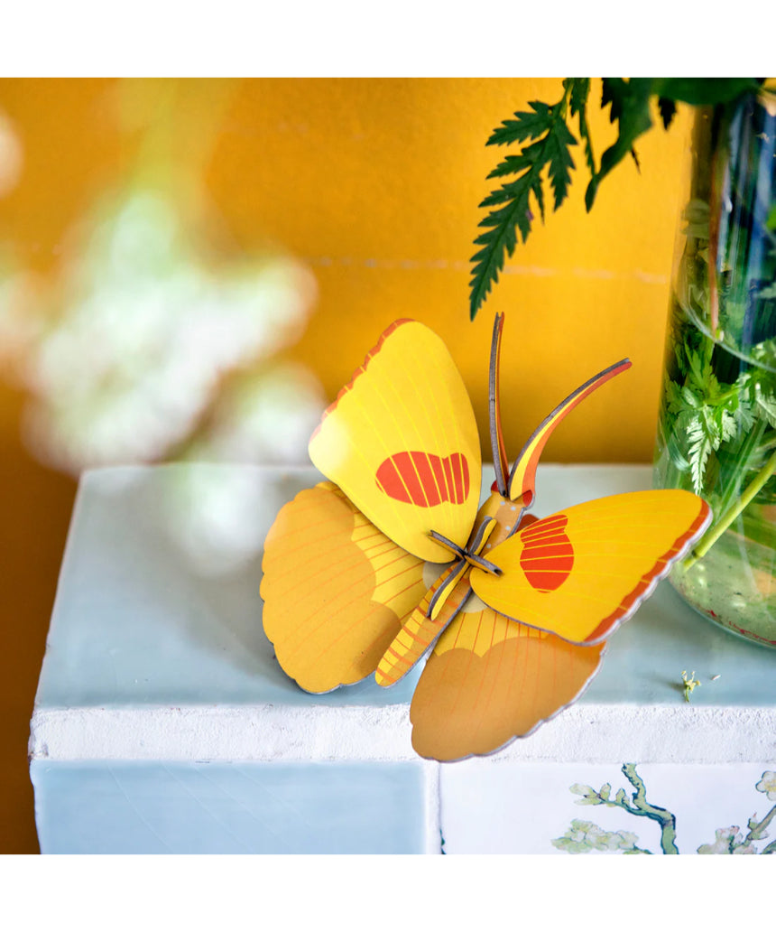 Yellow butterfly wall art by Studio Roof featuring a vibrant butterfly design on a decorative wall decor piece.