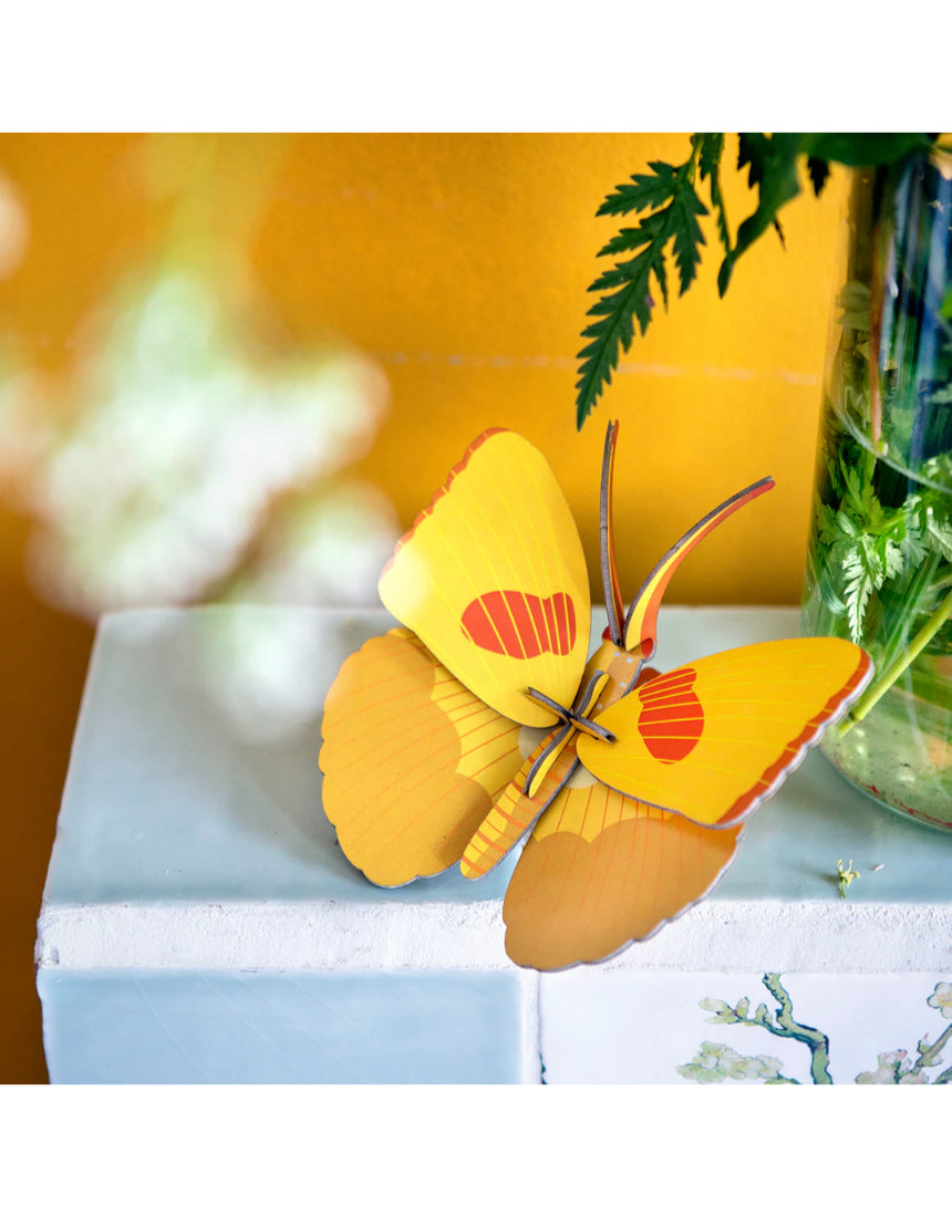 Yellow butterfly wall art by Studio Roof featuring a vibrant butterfly design on a decorative wall decor piece.
