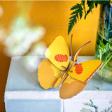 Yellow butterfly wall art by Studio Roof featuring a vibrant butterfly design on a decorative wall decor piece.
