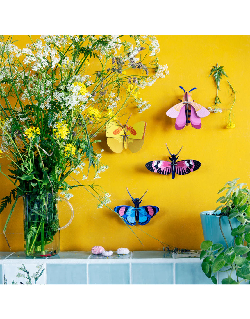 Yellow butterfly wall art by Studio Roof featuring vibrant butterflies on a decorative wall decor piece.