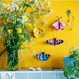 Yellow butterfly wall art by Studio Roof featuring vibrant butterflies on a decorative wall decor piece.