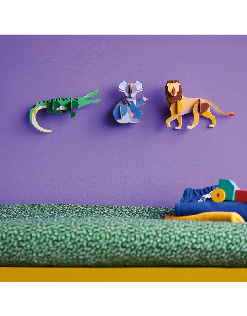 Studio Roof wall decor featuring a detailed crocodile illustration on a jungle-themed background.