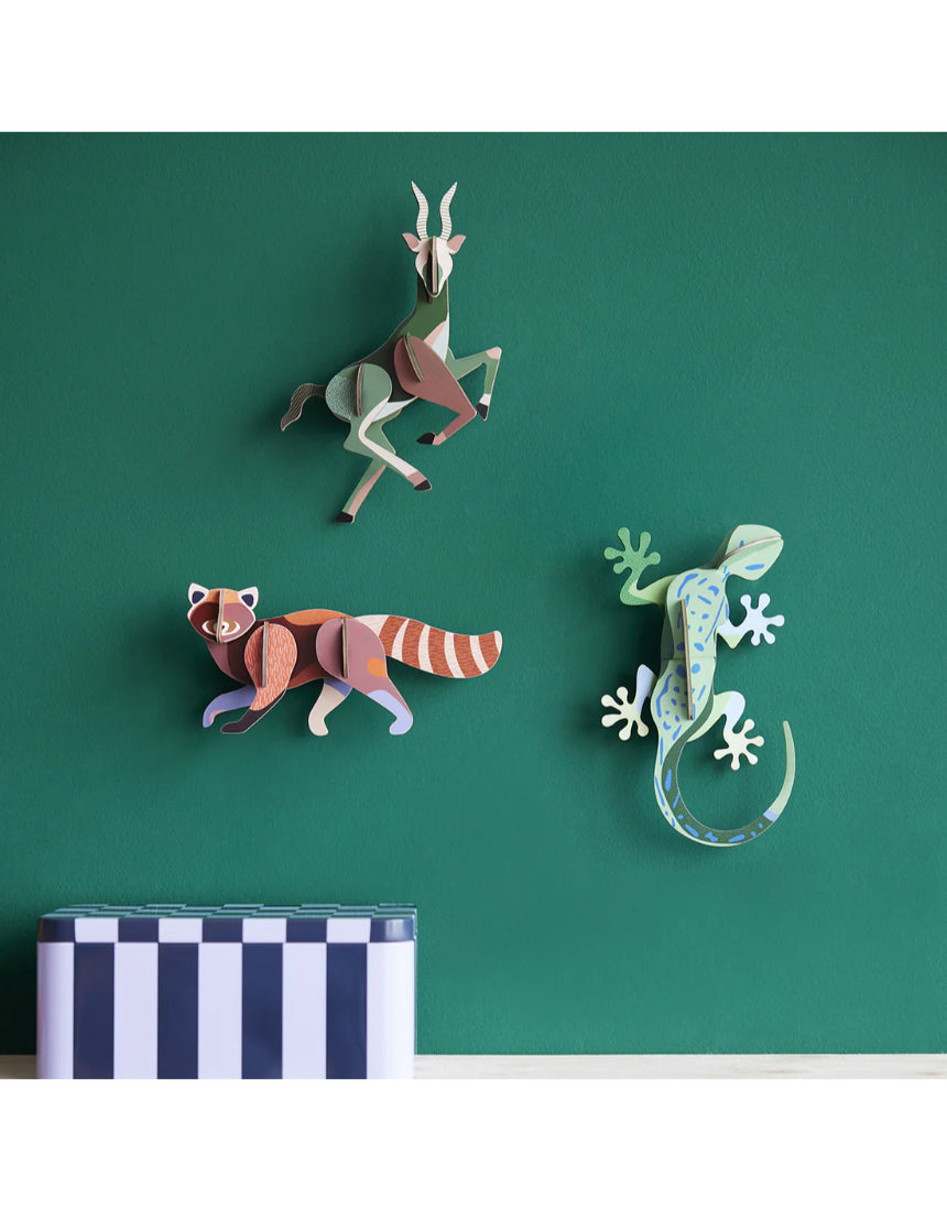 Studio Roof wall art featuring a colorful jungle gecko, a vibrant piece of wall decor for adding tropical style to any space.
