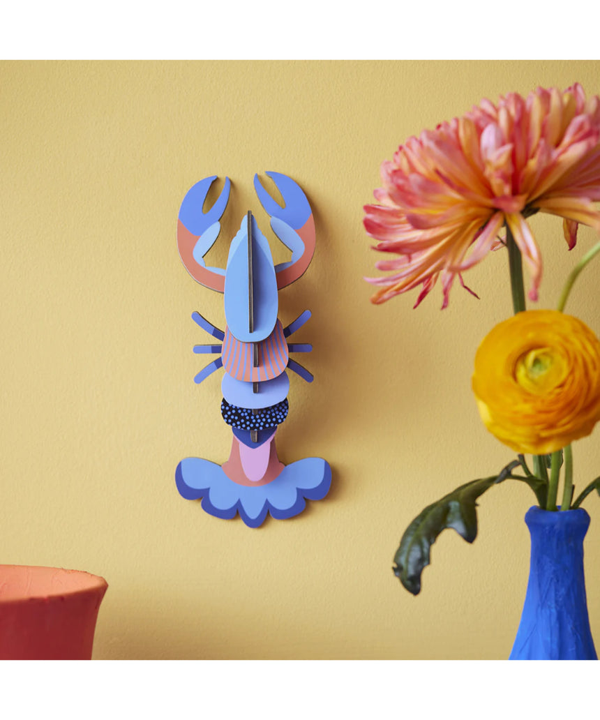 Studio Roof wall art featuring a vibrant lobster sea creature in a decorative wall decor piece.