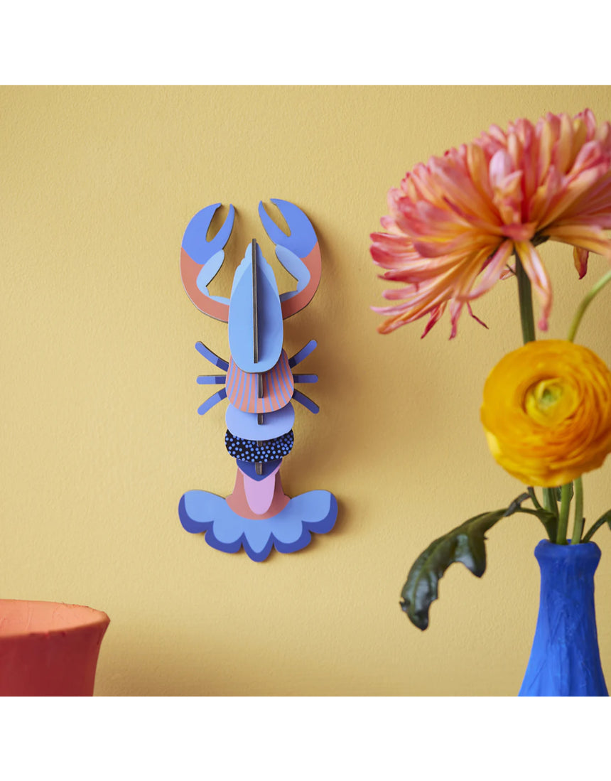 Studio Roof wall art featuring a vibrant lobster sea creature in a decorative wall decor piece.