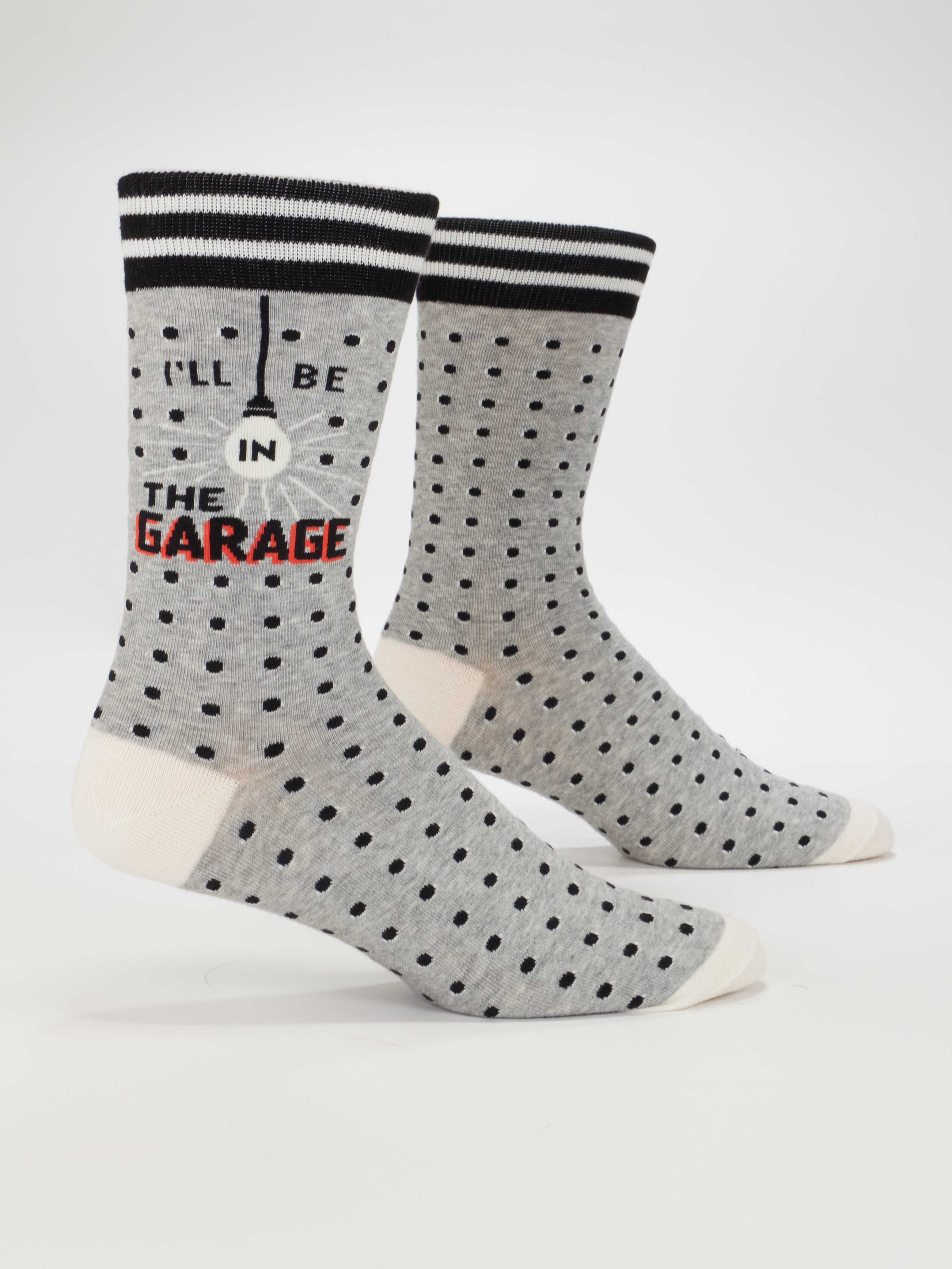 Blue Q men's crew socks featuring a garage-themed design with humorous text, perfect for casual wear.