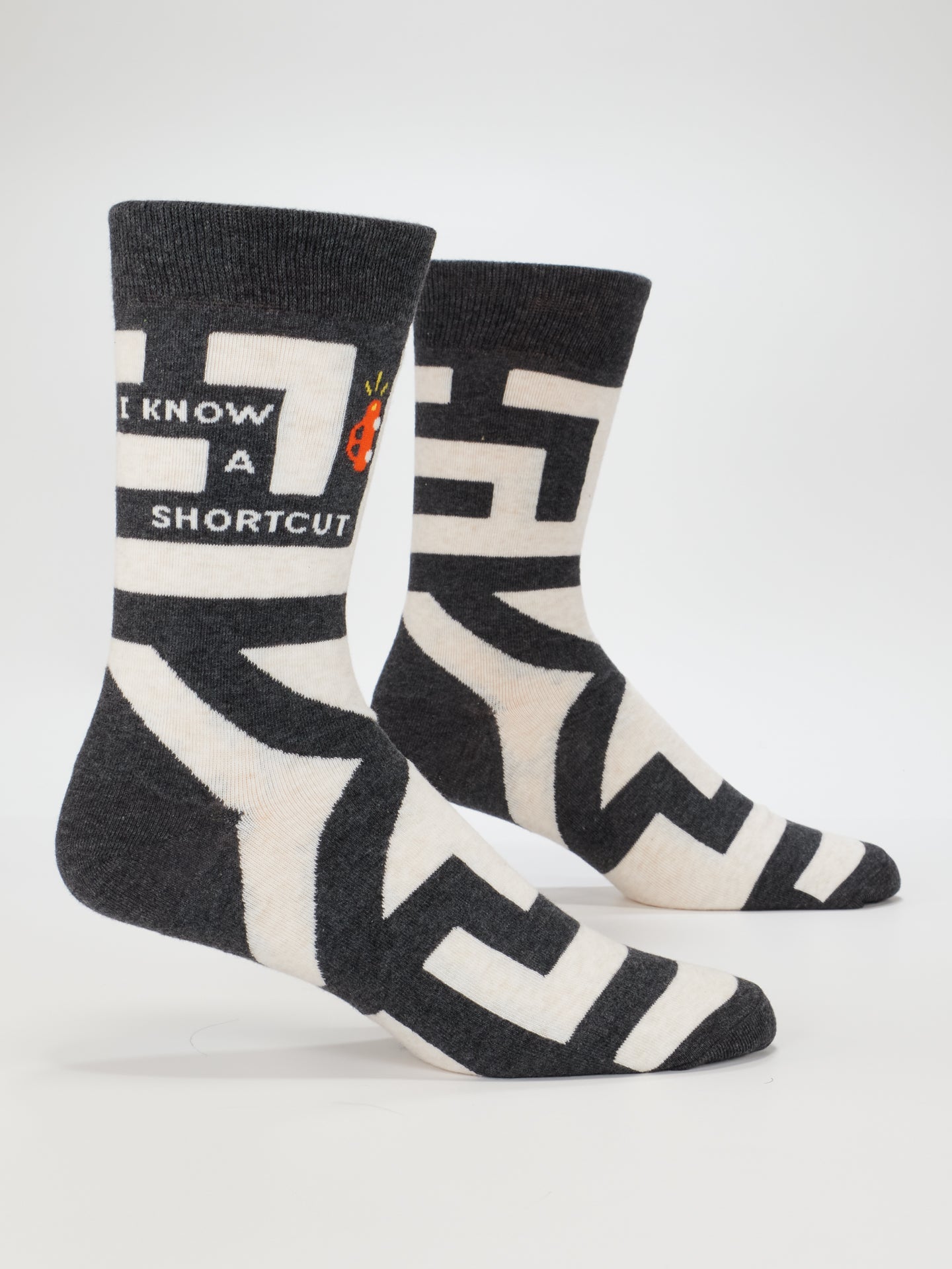 Blue Q men's crew socks featuring the "I Know A Shortcut" design with a blue color and fun printed pattern.